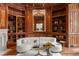 Beautiful library with custom wood paneling, built-in bookshelves, and an ornate mirror at 4560 Harris Trl, Atlanta, GA 30327