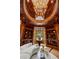 Stunning library features custom woodwork, built-in bookshelves, soaring ceilings and elegant chandelier at 4560 Harris Trl, Atlanta, GA 30327