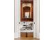 View of the stylish home library through an open doorway, showcasing custom shelving and decor at 4560 Harris Trl, Atlanta, GA 30327