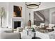 Elegant living room featuring stylish decor, fireplace, and view of curved staircase at 4560 Harris Trl, Atlanta, GA 30327