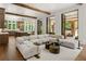 Spacious living area with exposed beams, a modern kitchen and patio access at 4560 Harris Trl, Atlanta, GA 30327