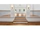 Living room featuring hardwood floors, white columns, and an open floor plan at 4560 Harris Trl, Atlanta, GA 30327