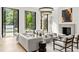 Bright, stylish living room with high ceilings, modern lighting, and French doors overlooking the yard at 4560 Harris Trl, Atlanta, GA 30327