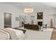 Spacious main bedroom boasts a sitting area, fireplace, and ample natural light, creating a relaxing retreat at 4560 Harris Trl, Atlanta, GA 30327