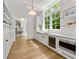Bright, white pantry featuring custom shelving, ample storage, and stainless steel appliances at 4560 Harris Trl, Atlanta, GA 30327