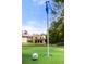 Backyard putting green featuring artificial turf and backdrop view of home at 4560 Harris Trl, Atlanta, GA 30327