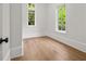 This bright room features gorgeous hardwood flooring and windows, perfect for relaxation or productivity at 4560 Harris Trl, Atlanta, GA 30327