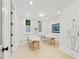 Bright spa room featuring two massage tables, and a robe hanging on the wall at 4560 Harris Trl, Atlanta, GA 30327