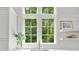 A picturesque window offers a stunning view of lush greenery at 4560 Harris Trl, Atlanta, GA 30327