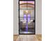 Modern wine cellar featuring glass door, arched ceiling, ample storage, and elegant seating area at 4560 Harris Trl, Atlanta, GA 30327