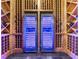 Custom wine storage room with dual wine refrigerators and wooden shelving units at 4560 Harris Trl, Atlanta, GA 30327