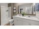 This modern bathroom features a double vanity, commode, and shower with a tub at 4954 Jatoba Rd # 72, Acworth, GA 30101