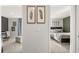 Between two bedrooms are botanical art pieces and a view into a Bedroom and a guest bedroom at 4954 Jatoba Rd # 72, Acworth, GA 30101