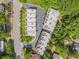 An aerial view of the townhome roofs including the community pool in a lush neighborhood at 710 Oakview Rd, Decatur, GA 30030