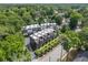 Aerial view of modern townhouses surrounded by lush trees and landscaping in a quiet neighborhood at 710 Oakview Rd, Decatur, GA 30030