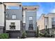 Contemporary townhome featuring a private garage and second story balcony, with modern architecture at 710 Oakview Rd, Decatur, GA 30030