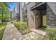 Brick townhouse featuring well-maintained landscaping, front door and walkway at 710 Oakview Rd, Decatur, GA 30030