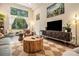 Bright living room with hardwood floors, large window, and eclectic decor at 710 Oakview Rd, Decatur, GA 30030