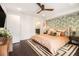 Spacious bedroom showcasing hardwood floors, designer wallpaper, and a modern ceiling fan at 710 Oakview Rd, Decatur, GA 30030