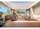 Inviting rooftop deck with shade, wood flooring, seating, and serene views of the surrounding trees at 710 Oakview Rd, Decatur, GA 30030