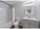 Clean bathroom with a shower-tub combination, vanity, and neutral finishes at 16104 Waldrop Cv, Decatur, GA 30034