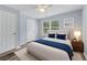 Cozy bedroom with natural light, a ceiling fan, and minimalist decor at 16104 Waldrop Cv, Decatur, GA 30034