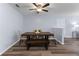 Cozy dining room featuring wood floors and modern table with seating for six at 16104 Waldrop Cv, Decatur, GA 30034
