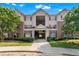 Traditional apartment building featuring brick accents, red shutters, and well-maintained landscaping at 16104 Waldrop Cv, Decatur, GA 30034