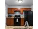 Efficient kitchen featuring modern appliances, wood cabinetry and granite countertops at 16104 Waldrop Cv, Decatur, GA 30034