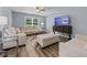 Comfortable living room with contemporary furniture, wood floors, and bright natural light at 16104 Waldrop Cv, Decatur, GA 30034