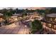 Beautiful aerial view of a lively shopping center with outdoor seating, mature trees and pedestrian walkways at 212 Brittany Ct, Duluth, GA 30096