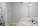 Bathroom with a double sink vanity, granite countertop, large mirror, and a shower with a floral curtain at 212 Brittany Ct, Duluth, GA 30096