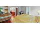 Bright bedroom with a wooden dresser, work desk, and adjacent bathroom featuring double sinks and cherry wood cabinetry at 212 Brittany Ct, Duluth, GA 30096