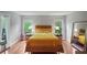 Serene bedroom featuring hardwood floors, with natural light and large mirror at 212 Brittany Ct, Duluth, GA 30096