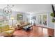 Comfortable living room with hardwood floors, lots of seating and natural light at 212 Brittany Ct, Duluth, GA 30096