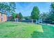 Community playground with a slide and swings on a large grassy area for children to enjoy at 212 Brittany Ct, Duluth, GA 30096