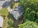Aerial view of home with lush landscaping, a deck, and a private backyard surrounded by mature trees at 2346 Unicoi Ct, Duluth, GA 30097
