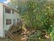 View of the tiered deck and patio area in a private backyard surrounded by mature trees at 2346 Unicoi Ct, Duluth, GA 30097