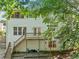 View of the backyard featuring a tiered deck and patio area, with a walkout basement at 2346 Unicoi Ct, Duluth, GA 30097