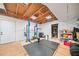 Unfinished basement space with gym equipment and storage shelves at 2346 Unicoi Ct, Duluth, GA 30097