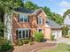 Traditional two-story brick home with black shutters, a well-kept lawn, and a two-car garage at 2346 Unicoi Ct, Duluth, GA 30097