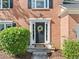 Close-up of the home's front door with a decorative wreath, framed by lush greenery and a welcoming entrance at 2346 Unicoi Ct, Duluth, GA 30097