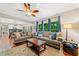 Inviting living room showcases hardwood floors, two sofas, natural light from backyard, and seamless access to the kitchen at 2346 Unicoi Ct, Duluth, GA 30097