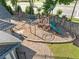 Community playground with swings, slide, climbing structure, and picnic table is perfect for outdoor fun at 2346 Unicoi Ct, Duluth, GA 30097
