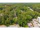 Lush trees surround a quiet street, and a still lake create a serene and private neighborhood at 2349 Northlake Ne Ct, Atlanta, GA 30345
