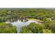 Scenic aerial view of a tranquil lake surrounded by lush, green trees, and homes in a serene neighborhood at 2349 Northlake Ne Ct, Atlanta, GA 30345