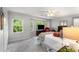 Bright bedroom with bay window, neutral carpet, ceiling fan, and white trim at 2349 Northlake Ne Ct, Atlanta, GA 30345