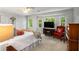 Light-filled bedroom with large windows, ceiling fan and neutral colored carpet at 2349 Northlake Ne Ct, Atlanta, GA 30345