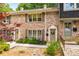 Charming brick townhome featuring a cozy front entrance and well-maintained landscaping at 2349 Northlake Ne Ct, Atlanta, GA 30345