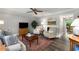 Cozy living room with a fireplace, plush seating, and views into the dining area at 2349 Northlake Ne Ct, Atlanta, GA 30345
